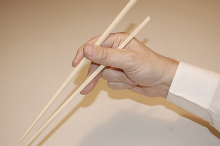 holding chopsticks