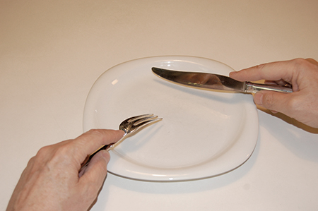 cutting and eating with a fork and knife