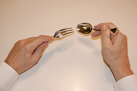 eating with a dessert fork and spoon